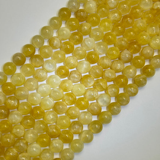 Golden Cat's eye Calcite Polished Round Beads image 0